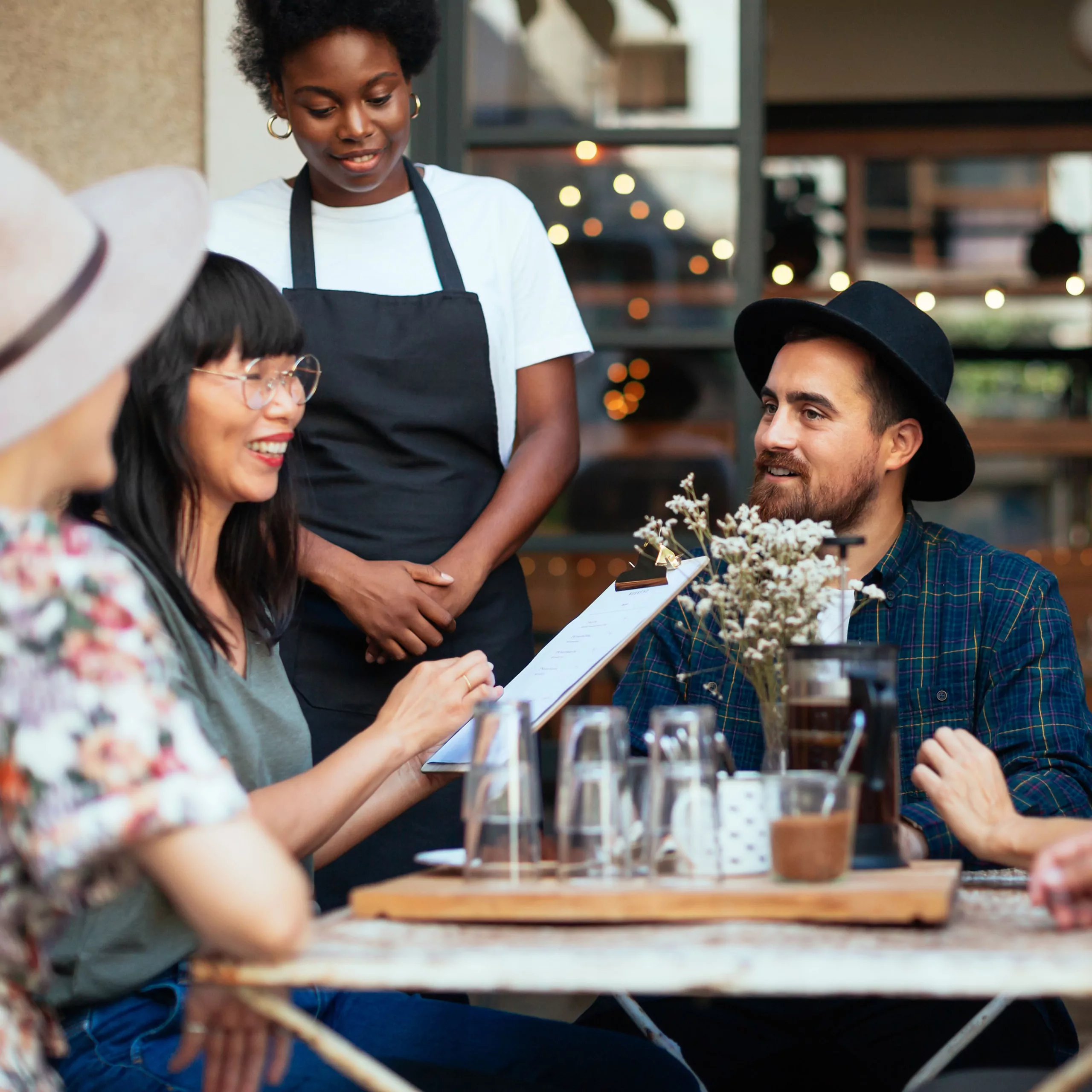 Friends ordering food at cafe